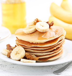 Banana Pancakes topped with Banana Slices & Walnuts