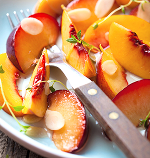 Summer Lemon Thyme Syrup Over Stone Fruit Served with Creme Fraiche