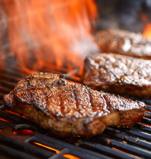 Smoky Strip Steaks with Mexican-Style Grilled Corn